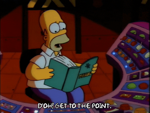 Cena dOs Simpsons em que Homer está sentado de frente para um painel cheio de botões e luzes. Ele está segurando um grande manual, falando 'Dã, vá pro ponto'.