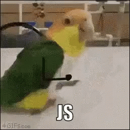 Imagem animada de um pássaro verde, amarelo e laranja dando pulos sobre uma mesa. Há braços estilo desenho de palito animados sobre a imagem, como se o pássaro estivesse comemorando. Na legenda, se lê 'JS'.